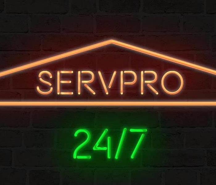 green and orange SERVPRO sign